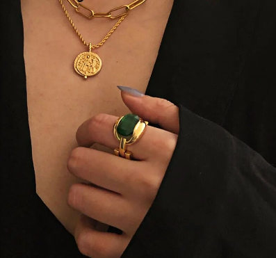 French elegant ring with green stone